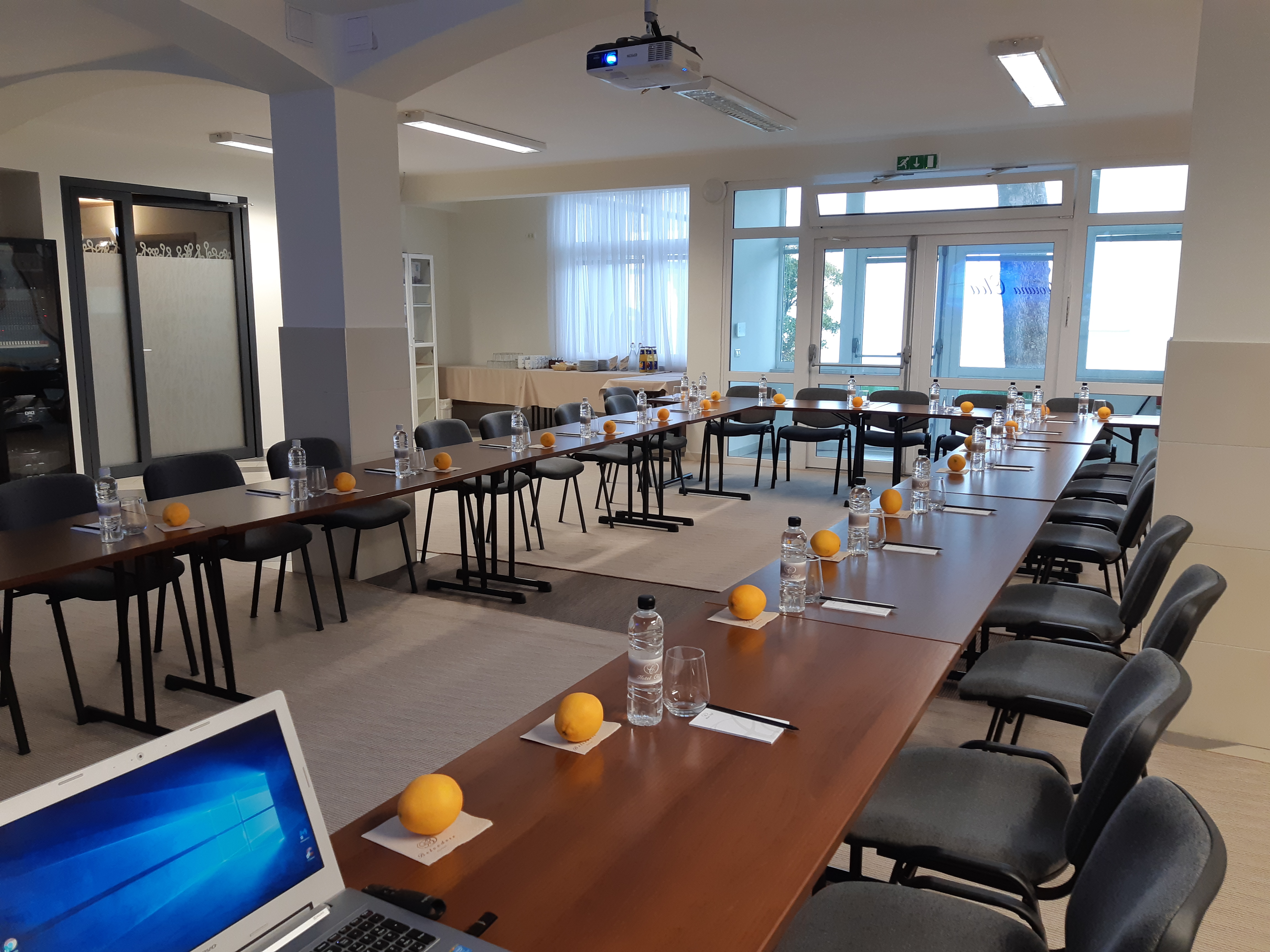 Olea hall with tables and chairs